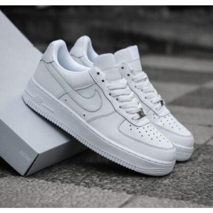 Side angle of Nike Air Force 1 Triple White casual sneakers.