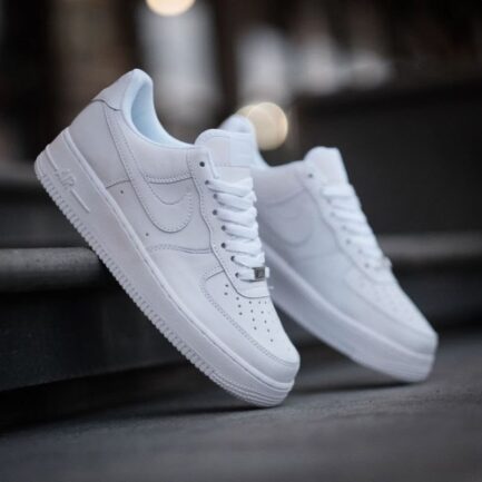 Classic Nike Air Force 1 Triple White premium leather shoes.