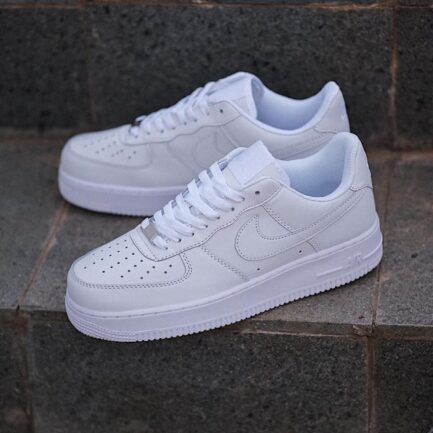 Nike Air Force 1 Triple White with durable rubber sole.