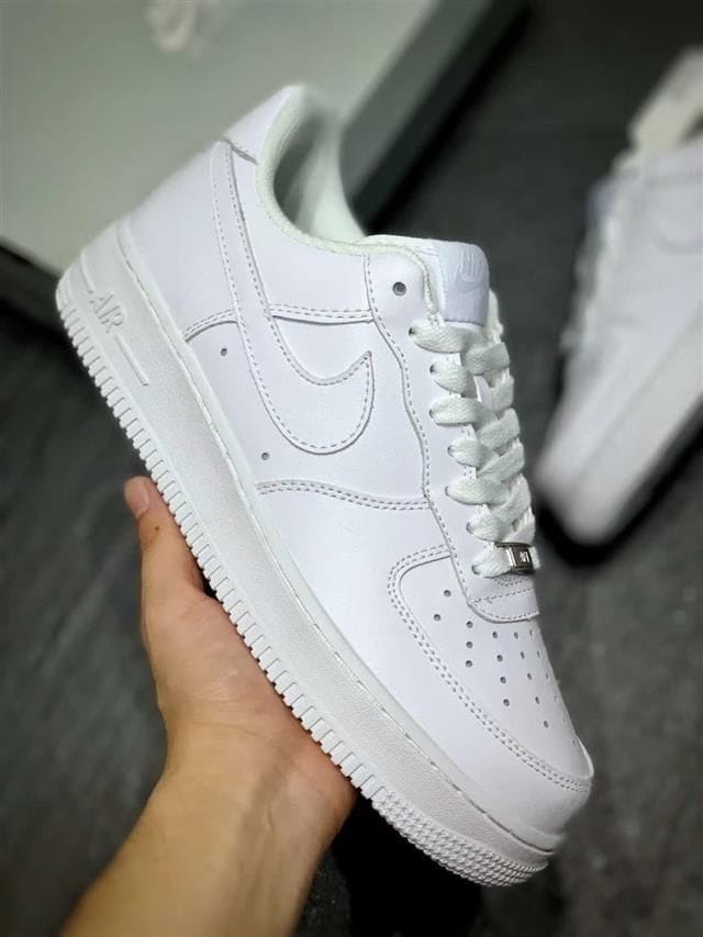 Nike Air Force 1 Triple White with durable rubber sole.