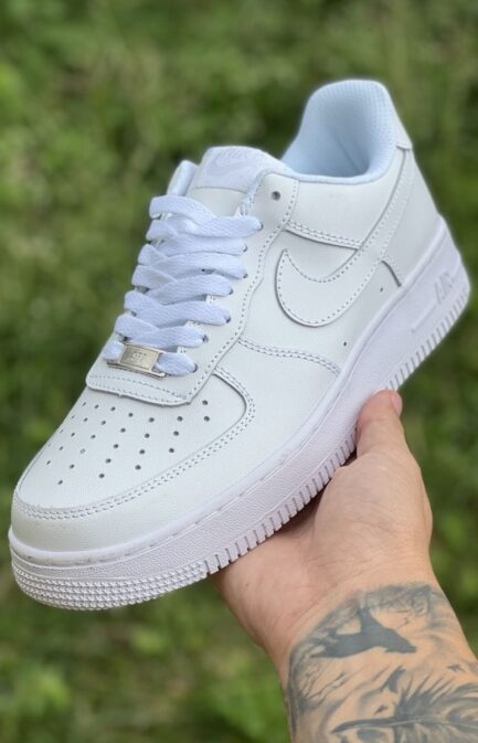 Front angle of Nike Air Force 1 Triple White casual sneakers.