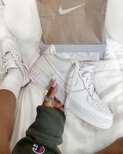 Stylish all-white Nike Womens AF1 sneakers for men & women.