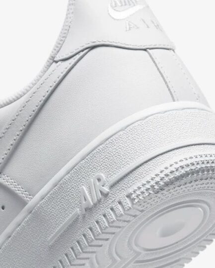 Classic Nike Air Force 1 Triple White premium leather shoes.