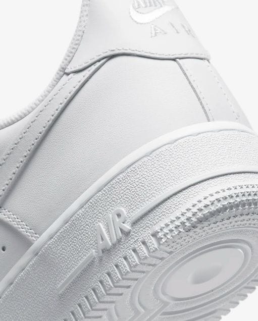 Classic Nike Air Force 1 Triple White premium leather shoes.