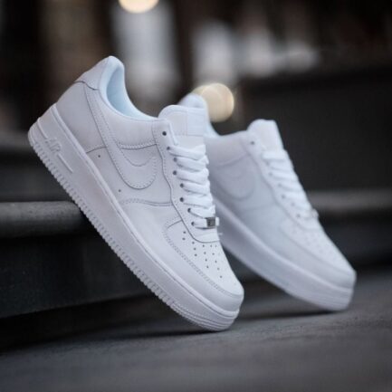Lifestyle shot of Nike Air Force 1 Triple White sneakers in Pakistan.