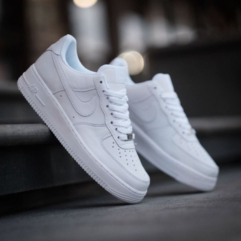 Lifestyle shot of Nike Air Force 1 Triple White sneakers in Pakistan.